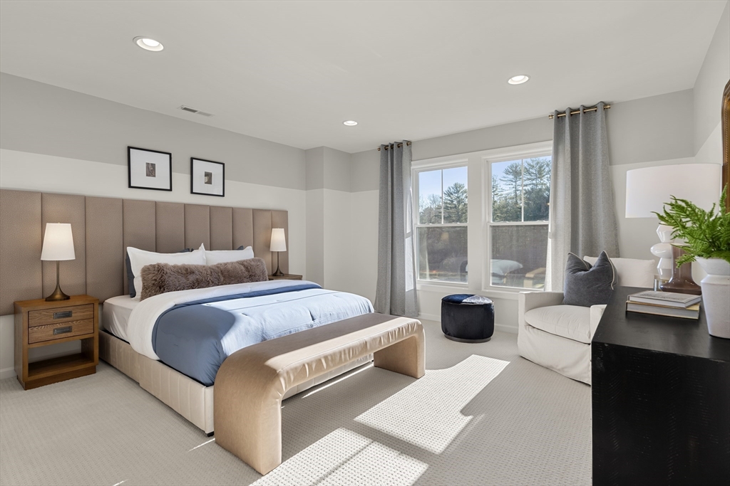 29 Germain Way, Unit 3 Norton, MA 02766 - Photo 31 of 40 a bedroom with a large bed and a couch