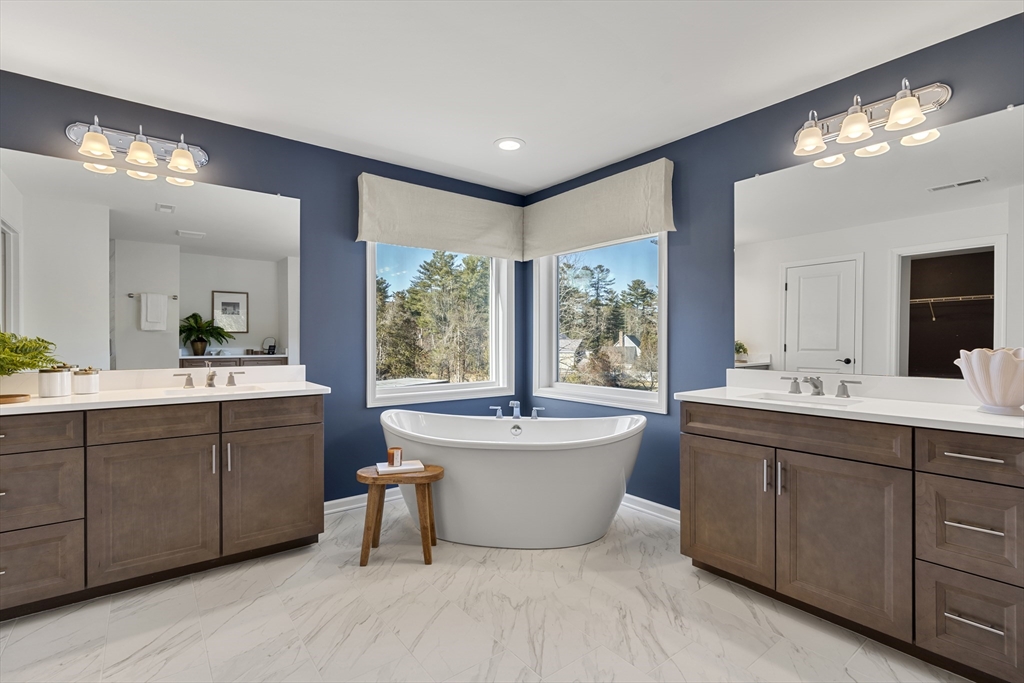 29 Germain Way, Unit 3 Norton, MA 02766 - Photo 36 of 40 a spacious bathroom with a double vanity sink mirror and bathtub