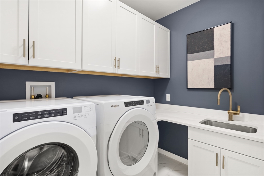 29 Germain Way, Unit 3 Norton, MA 02766 - Photo 38 of 40 a utility room with sink dryer and washer
