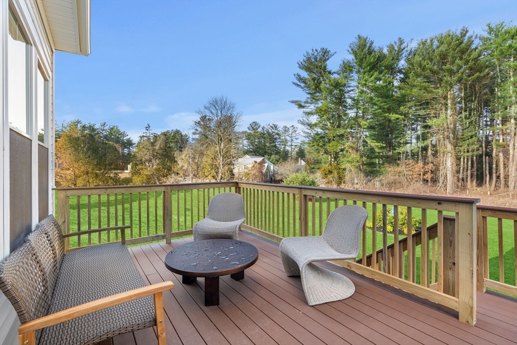 29 Germain Way, Unit 3 Norton, MA 02766 - Photo 39 of 40 a view of a balcony with wooden floor and outdoor seating
