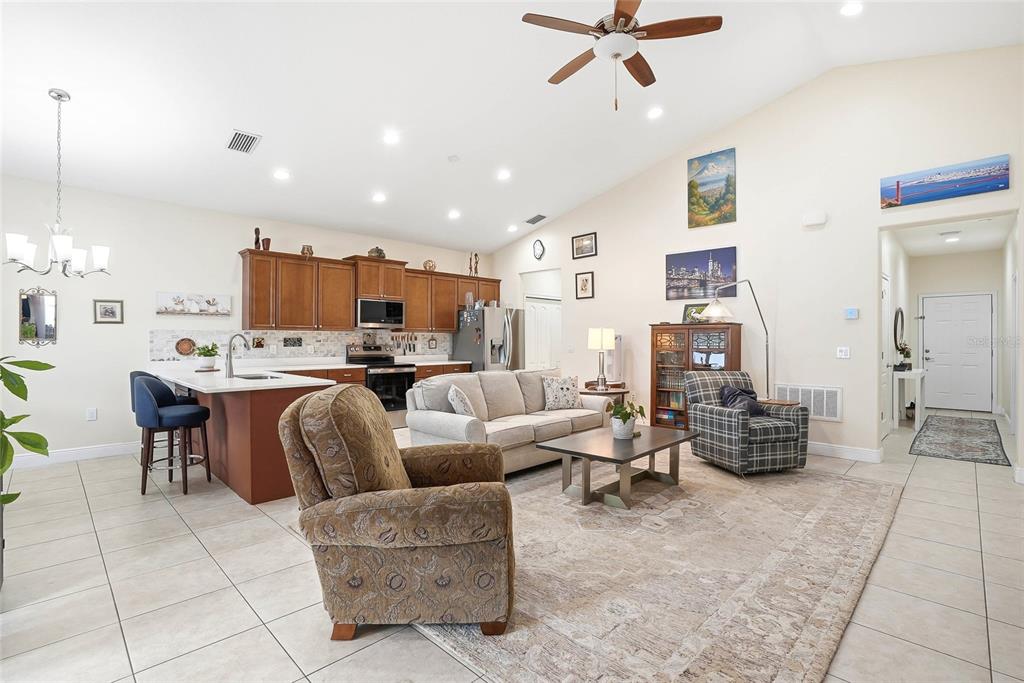 2906 West Douglas Street Tampa, FL 33607 - Photo 7 of 36 a living room with furniture kitchen view and a chandelier