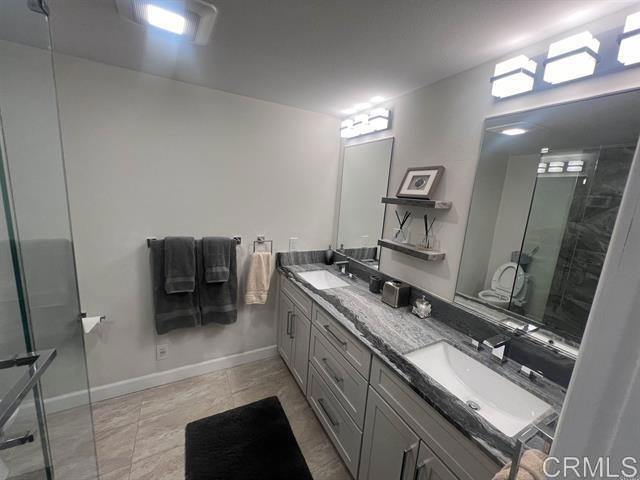 7061 Estrella De Mar Road, Unit 66 Carlsbad, CA 92009 - Photo 11 of 17 a kitchen with a stove and a sink