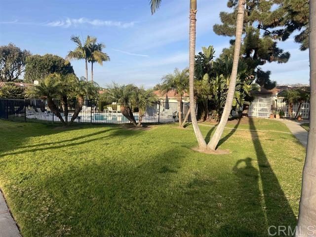 7061 Estrella De Mar Road, Unit 66 Carlsbad, CA 92009 - Photo 16 of 17 a view of a yard with swimming pool