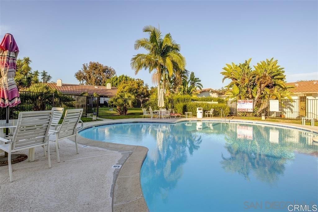 7061 Estrella De Mar Road, Unit 66 Carlsbad, CA 92009 - Photo 17 of 17 a view of a swimming pool and lounge chair