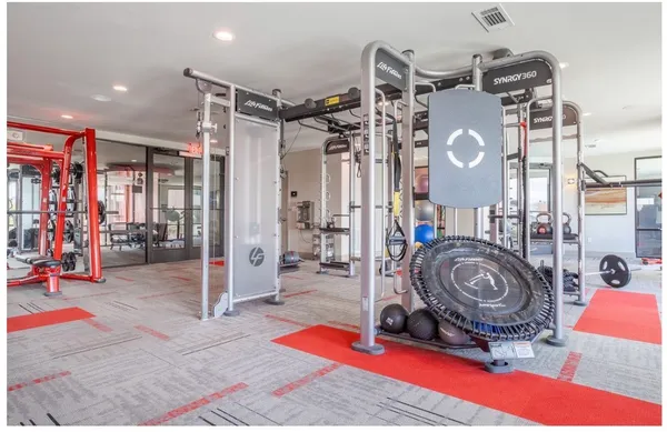 a room with lots of gym equipment