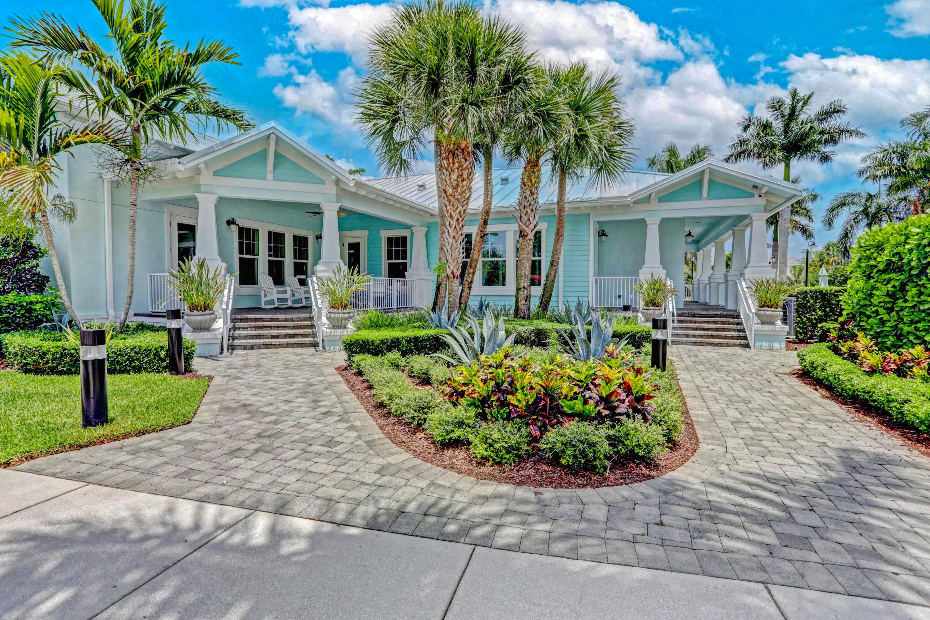 2758 Avalon Way Jupiter, FL 33458 - Photo 34 of 51 a front view of a house with a garden