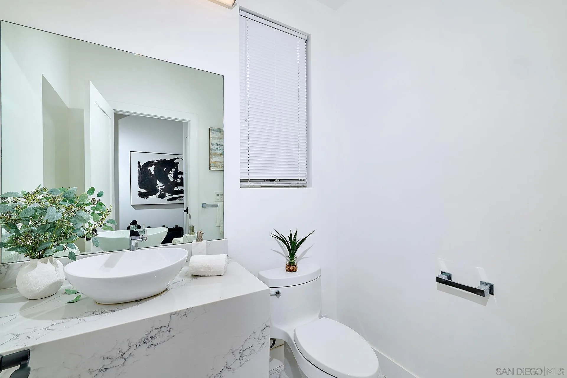 12410 Aria Court Poway, CA 92064 - Photo 14 of 47 a bathroom with a toilet a sink and mirror