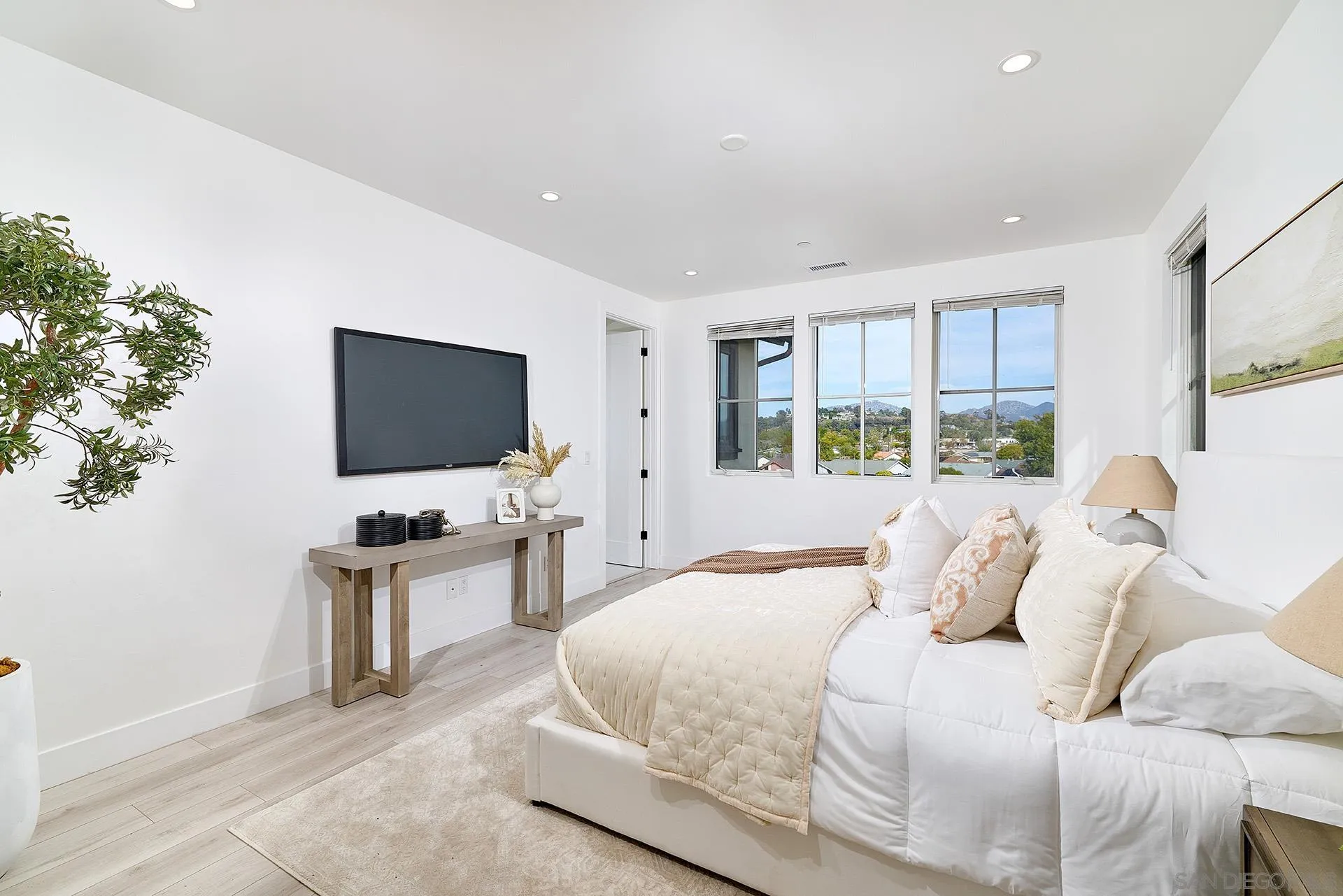 12410 Aria Court Poway, CA 92064 - Photo 17 of 47 a bedroom with a flat screen tv and a bed