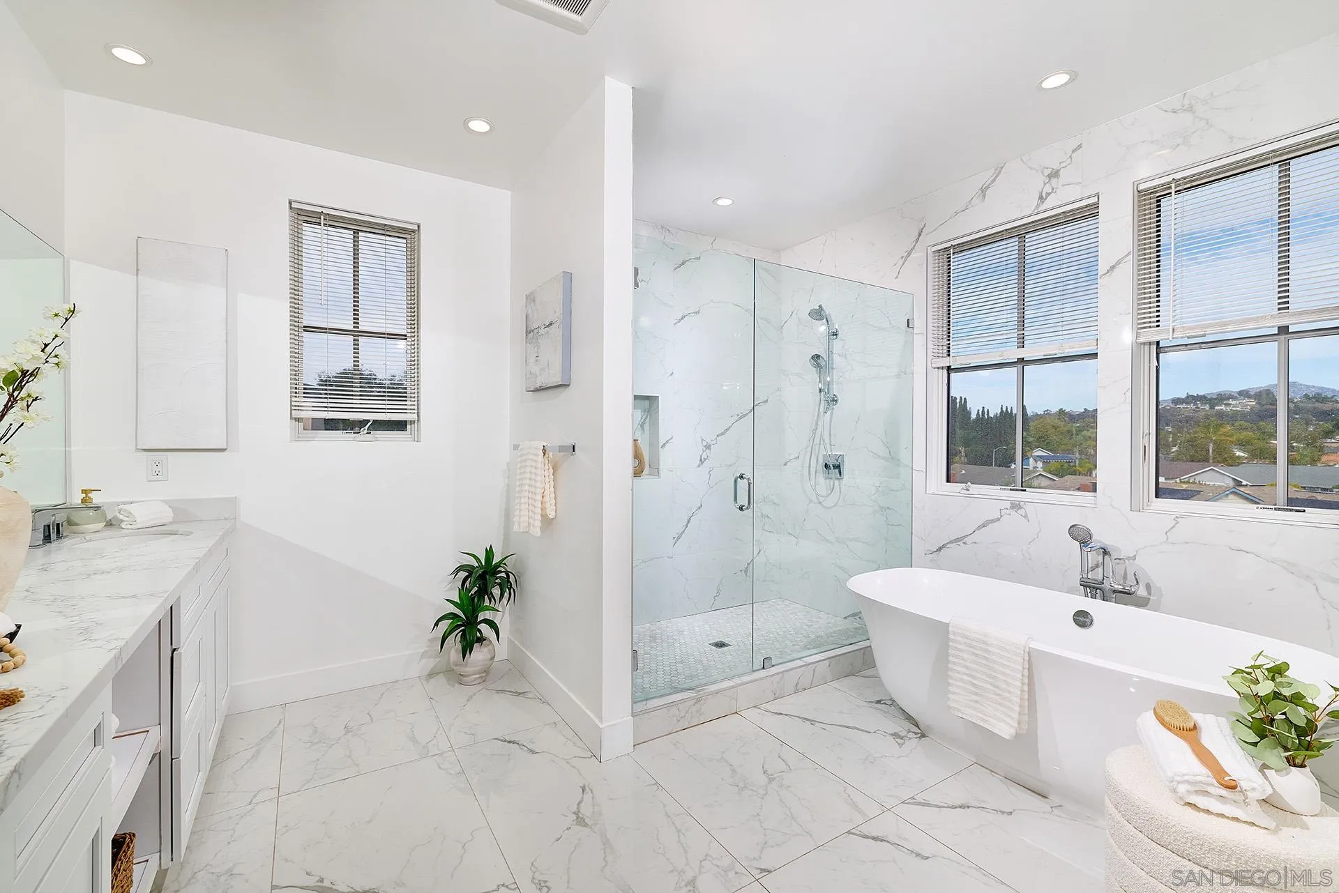 12410 Aria Court Poway, CA 92064 - Photo 19 of 47 a spacious bathroom with a double vanity sink and a bathtub