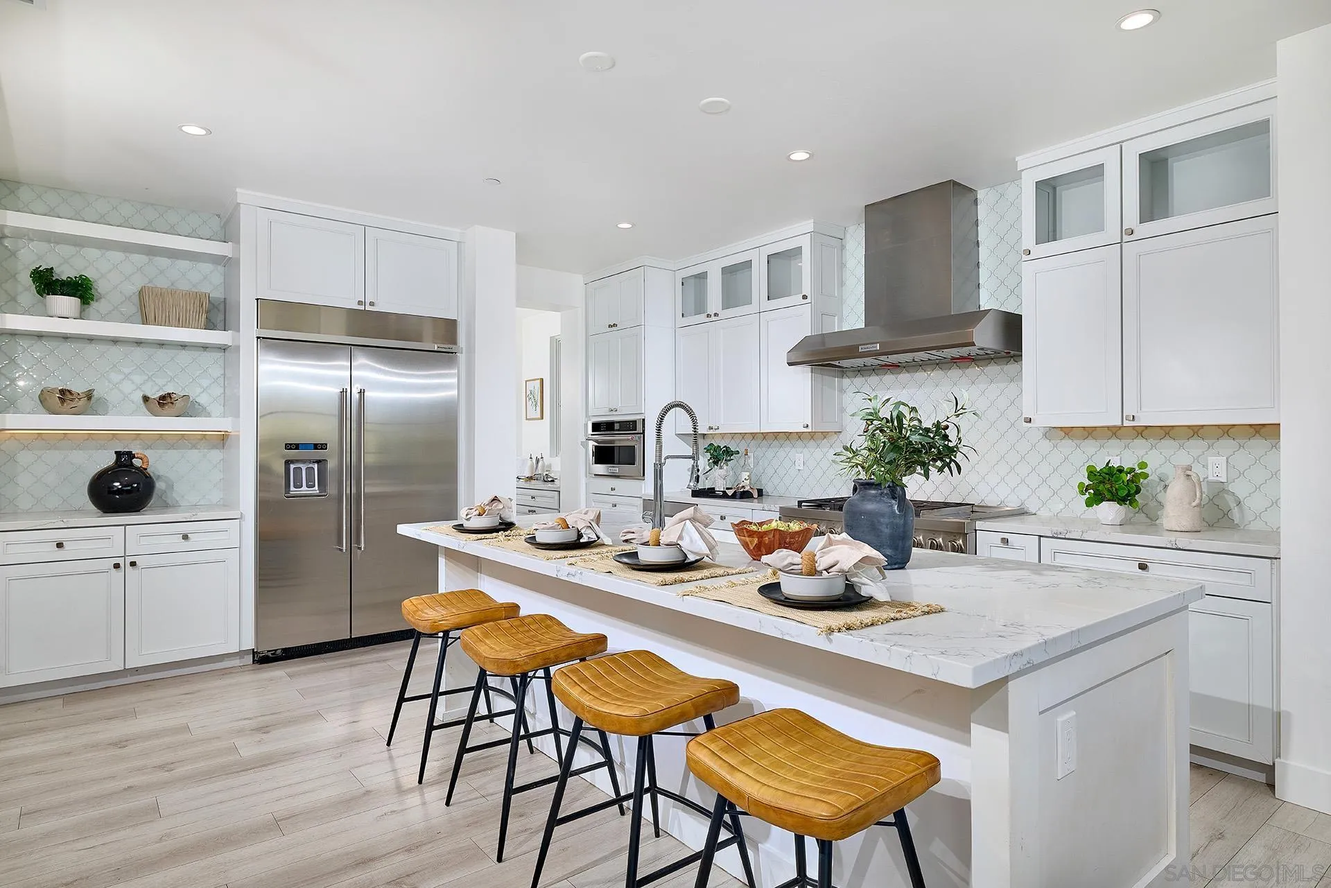 12410 Aria Court Poway, CA 92064 - Photo 2 of 47 a kitchen with a refrigerator a stove a sink and chairs