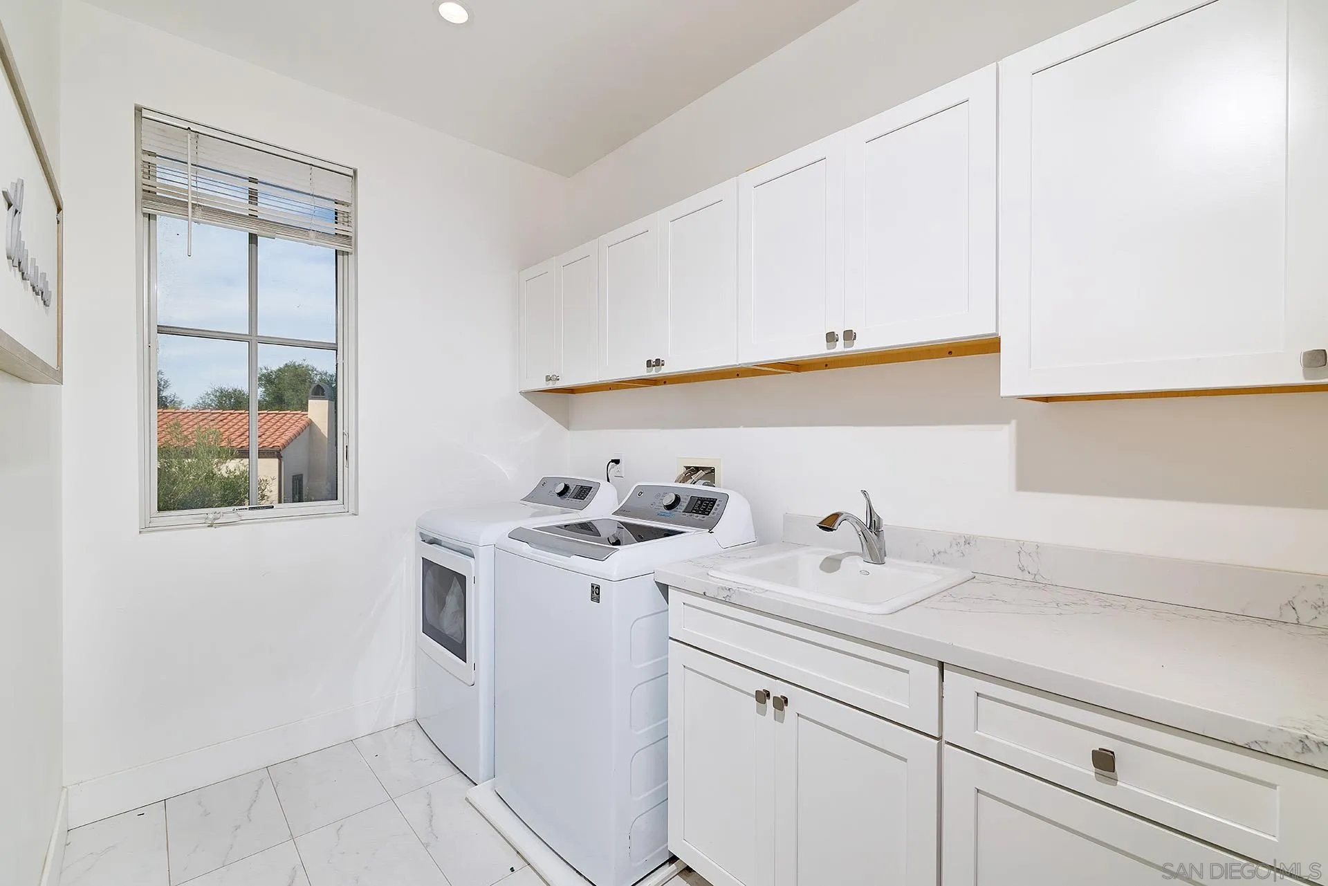 12410 Aria Court Poway, CA 92064 - Photo 25 of 47 a bathroom with a sink and a mirror