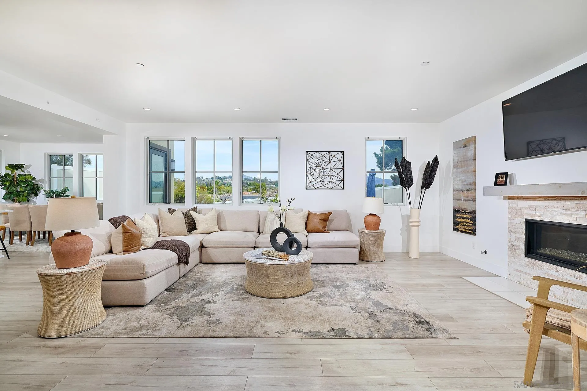 12410 Aria Court Poway, CA 92064 - Photo 5 of 47 a living room with furniture a flat screen tv and a fireplace