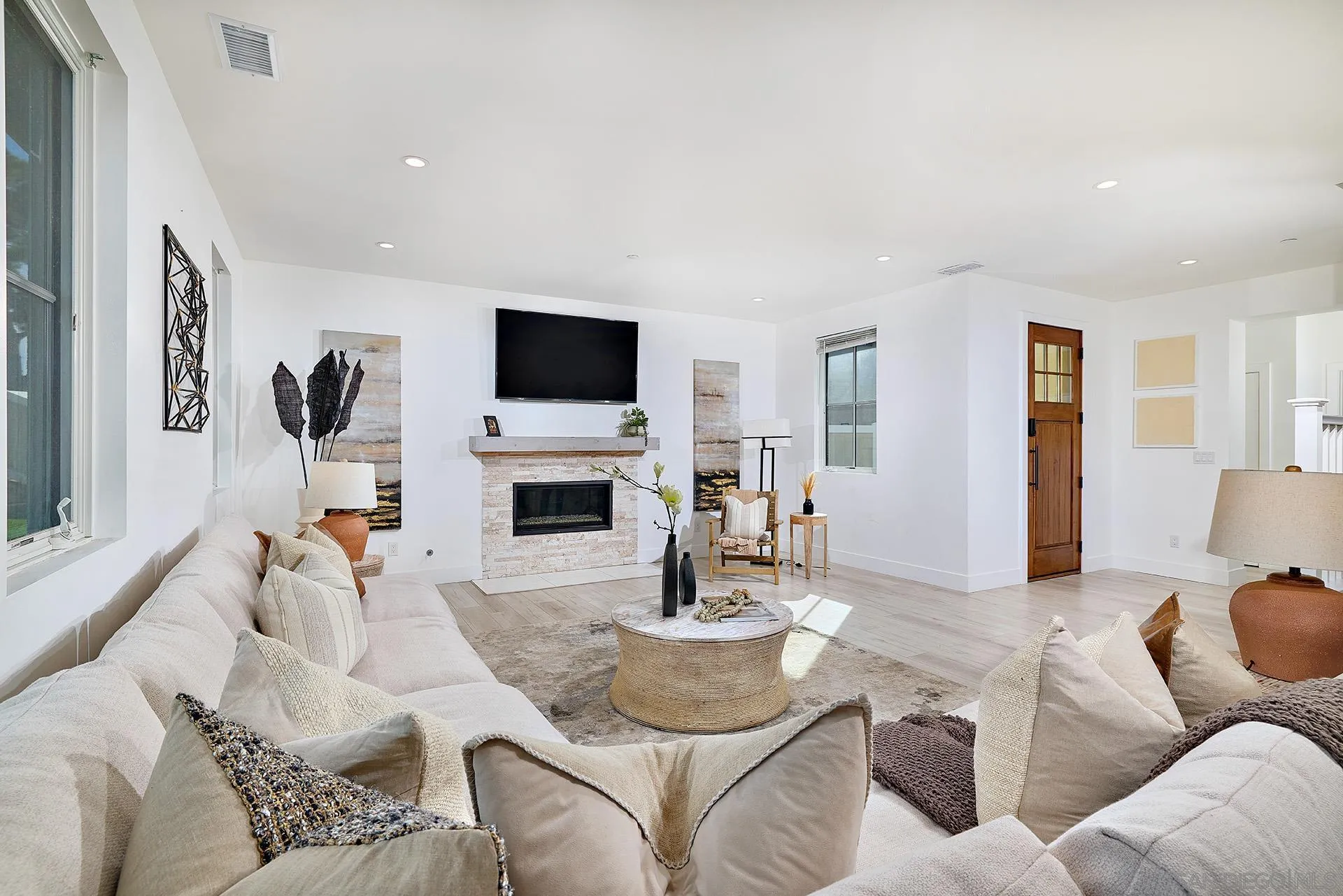 12410 Aria Court Poway, CA 92064 - Photo 7 of 47 a living room with furniture a fireplace and a flat screen tv