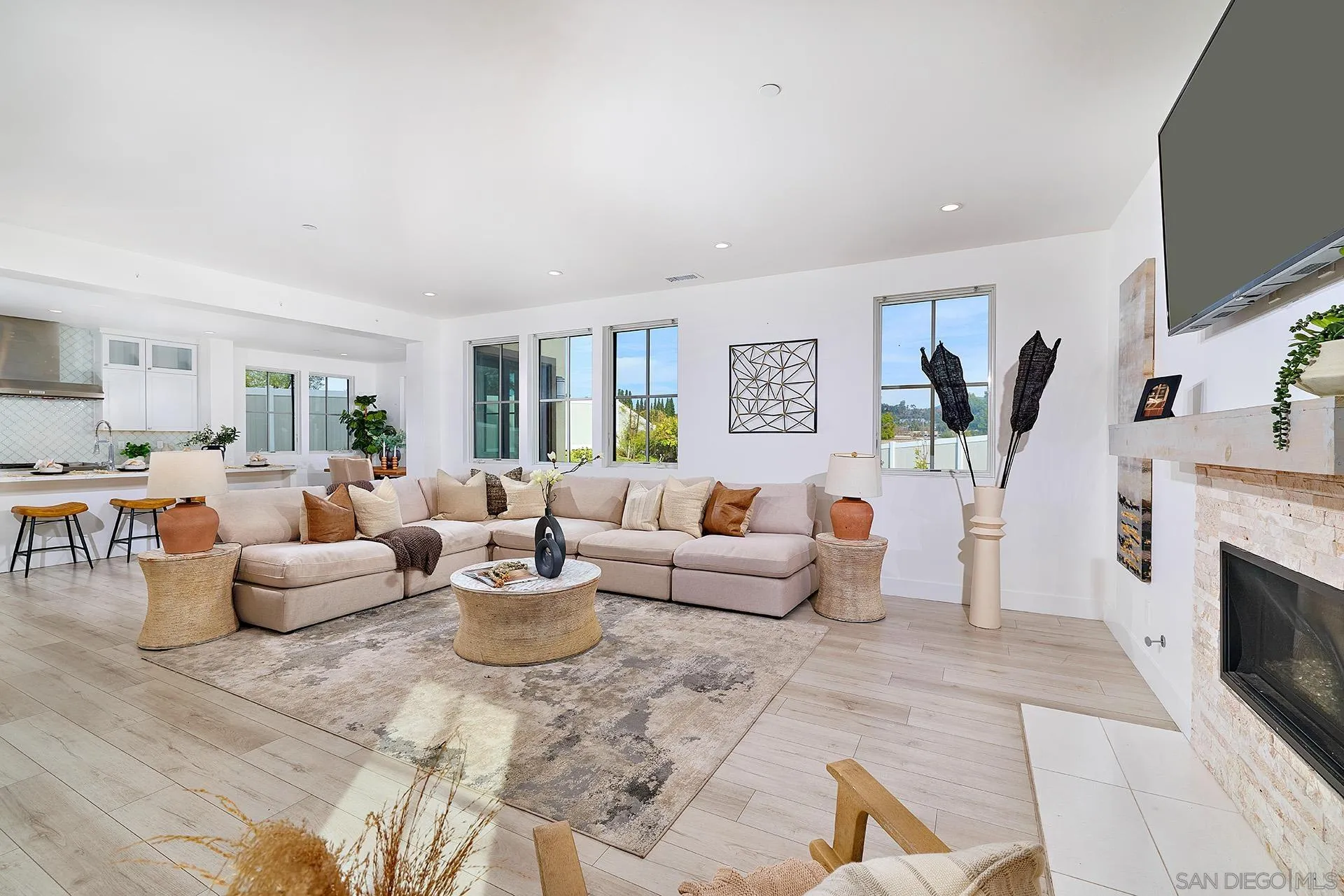 12410 Aria Court Poway, CA 92064 - Photo 9 of 47 a living room with fireplace furniture and a flat screen tv