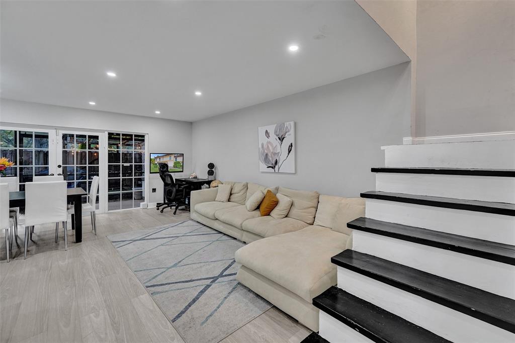 3301 Raleigh Street, Unit 4B Hollywood, FL 33021 - Photo 20 of 54 a living room with furniture and a book shelf
