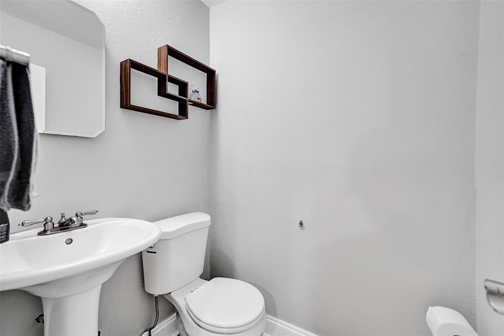 3301 Raleigh Street, Unit 4B Hollywood, FL 33021 - Photo 23 of 54 a bathroom with a sink mirror and toilet