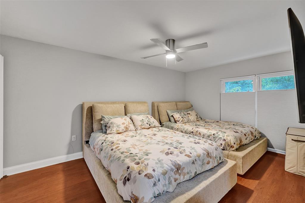 3301 Raleigh Street, Unit 4B Hollywood, FL 33021 - Photo 40 of 54 a bedroom with a large bed and a large window