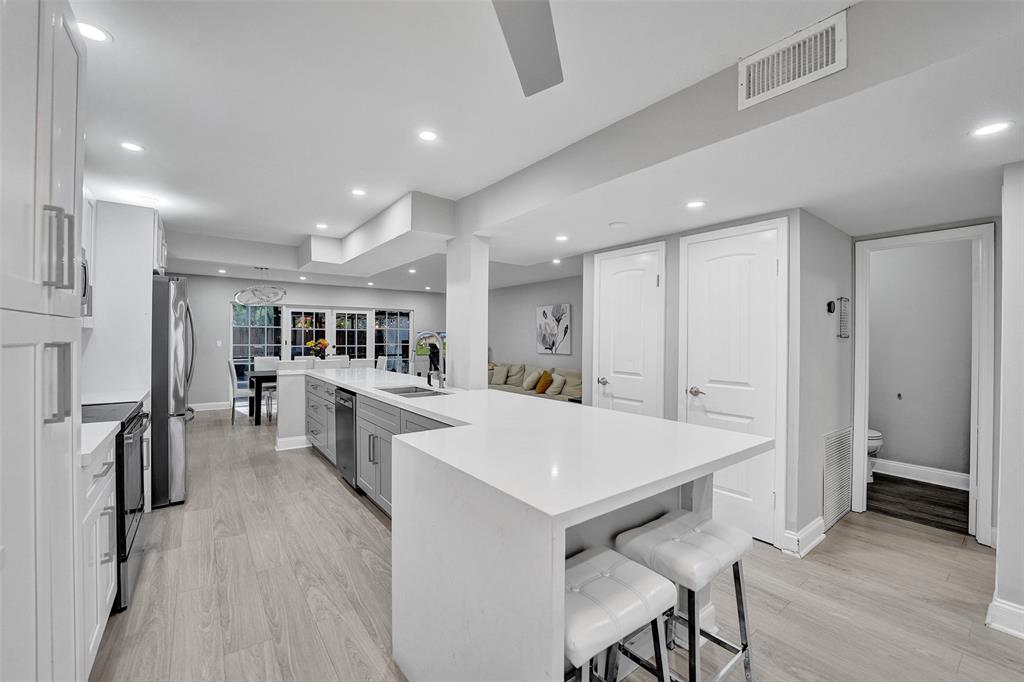 3301 Raleigh Street, Unit 4B Hollywood, FL 33021 - Photo 8 of 54 a view of kitchen with cabinets and wooden floor