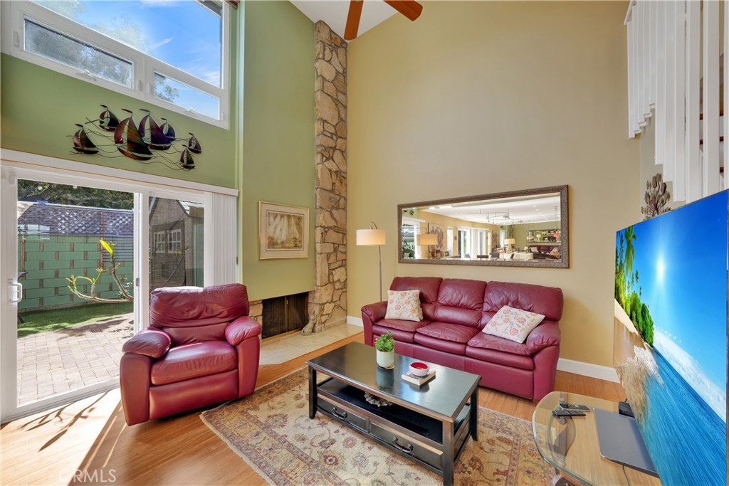2422 Miseno Way Costa Mesa, CA 92627 - Photo 16 of 40 a living room with furniture and a potted plant