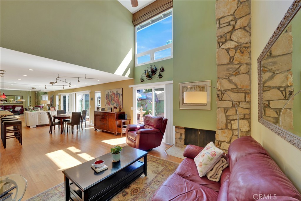 2422 Miseno Way Costa Mesa, CA 92627 - Photo 17 of 40 a living room with furniture and a fireplace