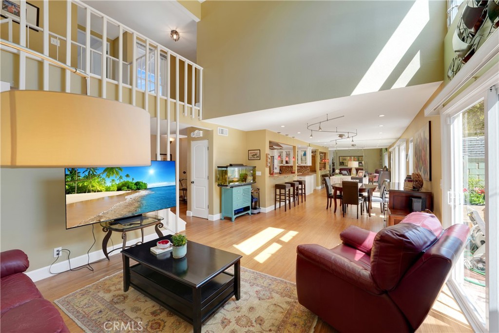 2422 Miseno Way Costa Mesa, CA 92627 - Photo 18 of 40 a living room with furniture and a large window