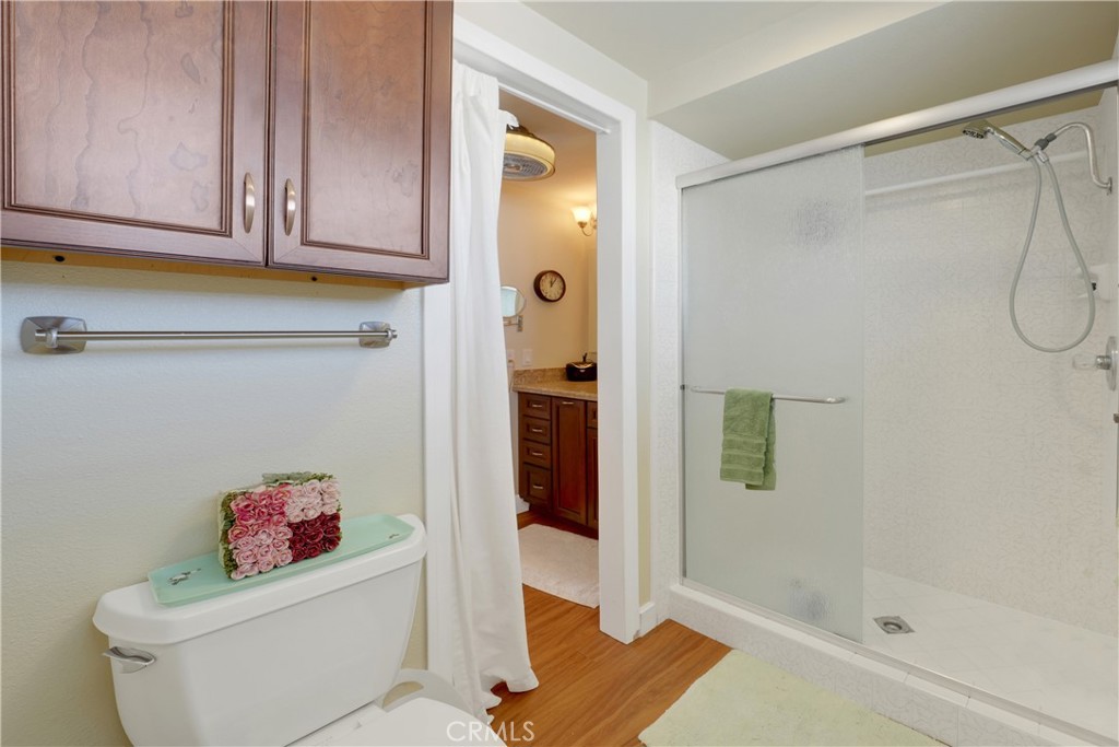 2422 Miseno Way Costa Mesa, CA 92627 - Photo 32 of 40 a bathroom with a shower and a toilet
