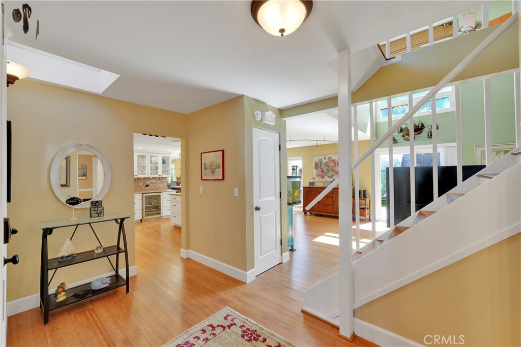 2422 Miseno Way Costa Mesa, CA 92627 - Photo 7 of 40 a view of an entryway with wooden floor