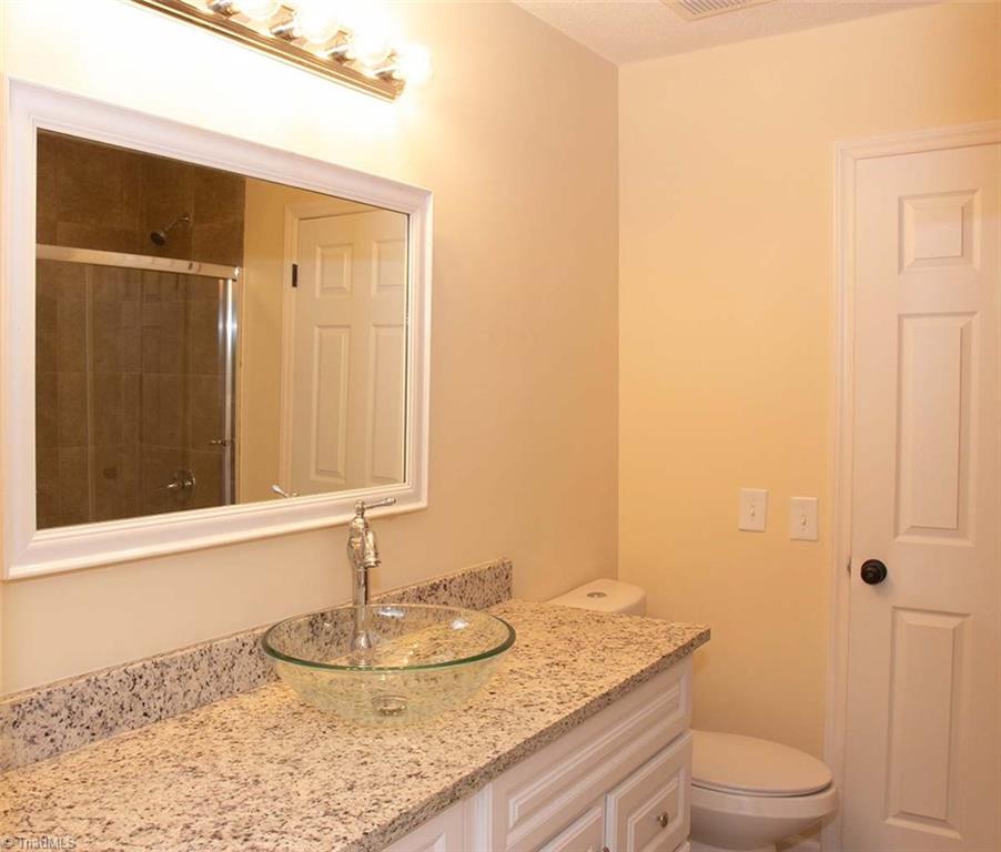 2824 Montclair Road Winston-Salem, NC 27106 - Photo 14 of 30 Jack & Jill style bathroom with granite countertop and vessel sink!