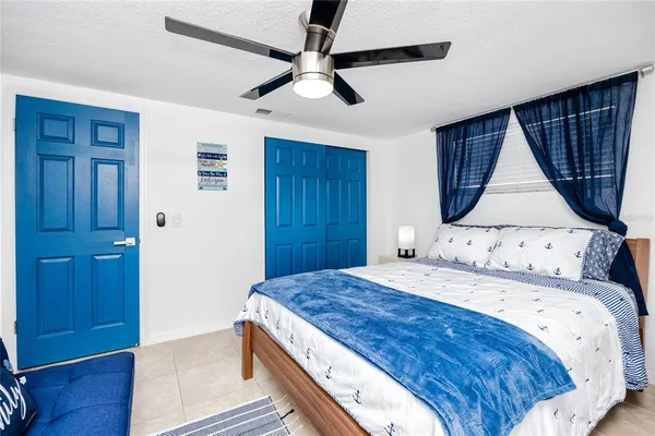 a bedroom with a bed and a dresser