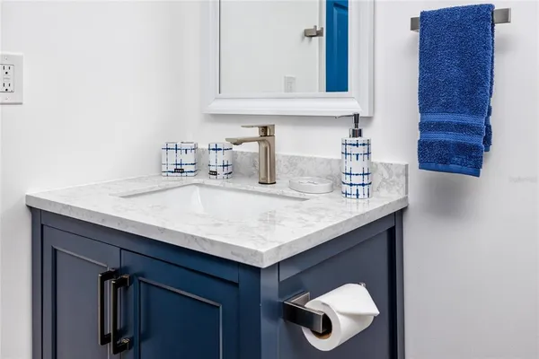 a kitchen with a sink a cabinets and a window