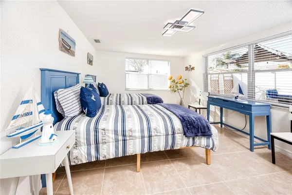 a bedroom with a bed and a table