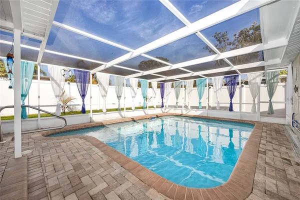 a view of a swimming pool with a porch