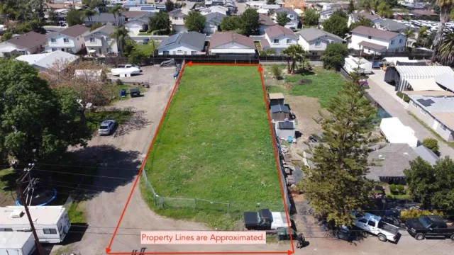 an aerial view of a house with a garden and swimming pool