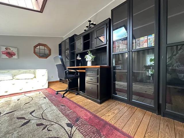 a bed room with a bed and a television