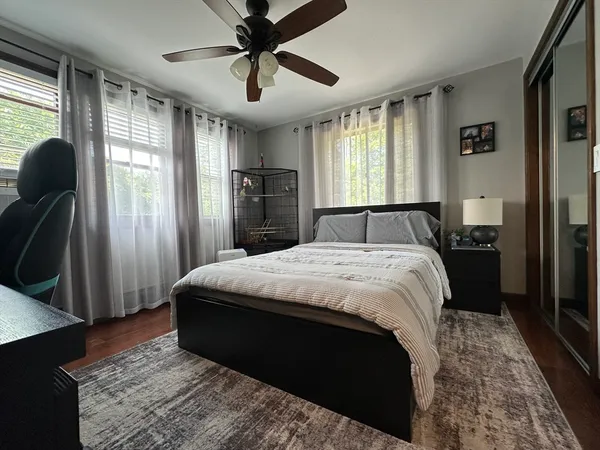 a bedroom with a large bed and a window