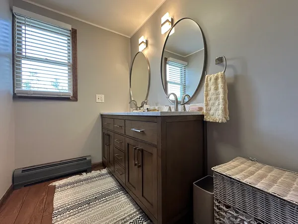 a view of a bathroom with a sink and mirror