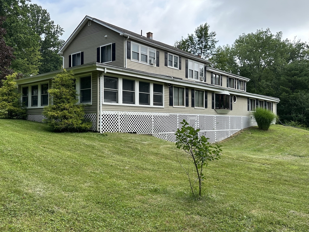170 Timberidge Drive Russell, MA 01071 - Photo 2 of 31 a front view of a house with a yard