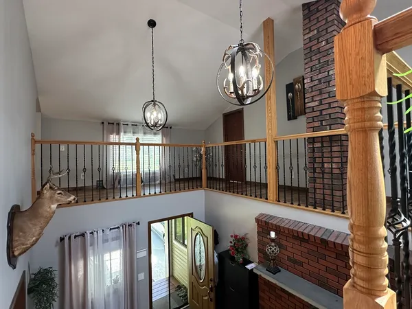 a view of entryway with wooden floor