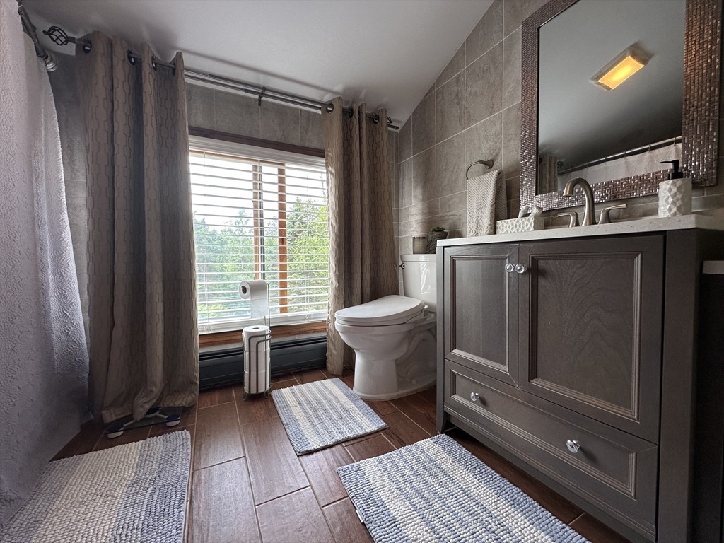 170 Timberidge Drive Russell, MA 01071 - Photo 30 of 31 a bathroom with a sink toilet and shower