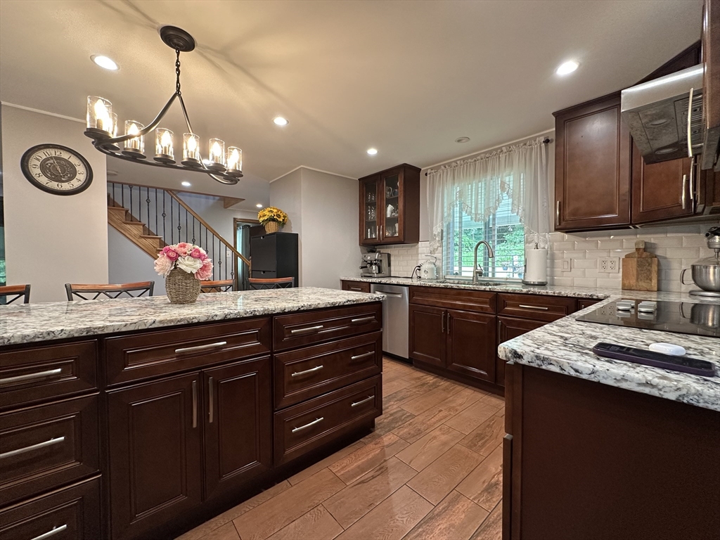 170 Timberidge Drive Russell, MA 01071 - Photo 7 of 31 a kitchen with a sink and a stove with cabinets