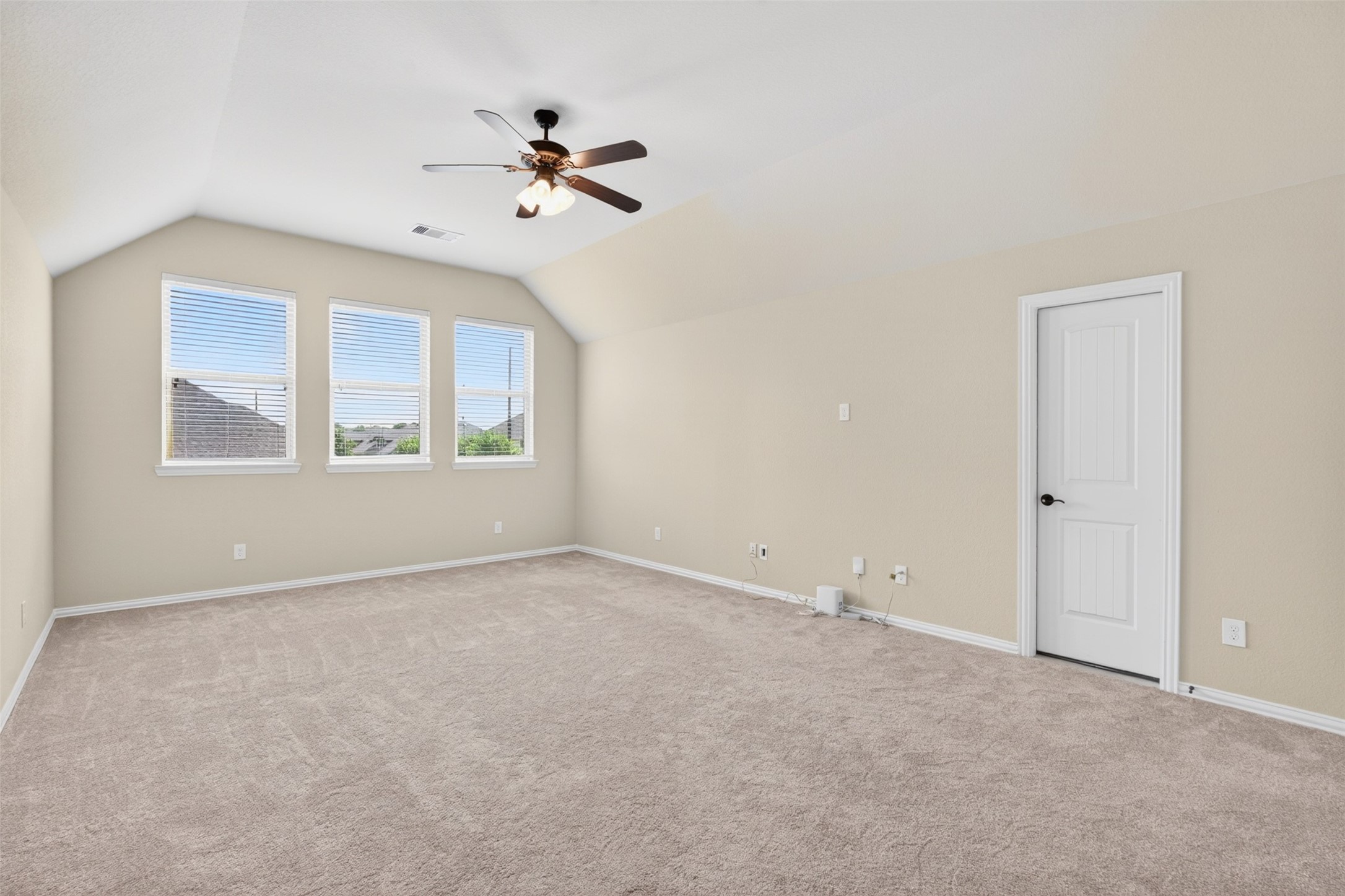 18202 Wedgewood Bluff Court Spring, TX 77379 - Photo 34 of 50 Upstairs game room with vaulted ceiling, ceiling fan, and flexible living space.