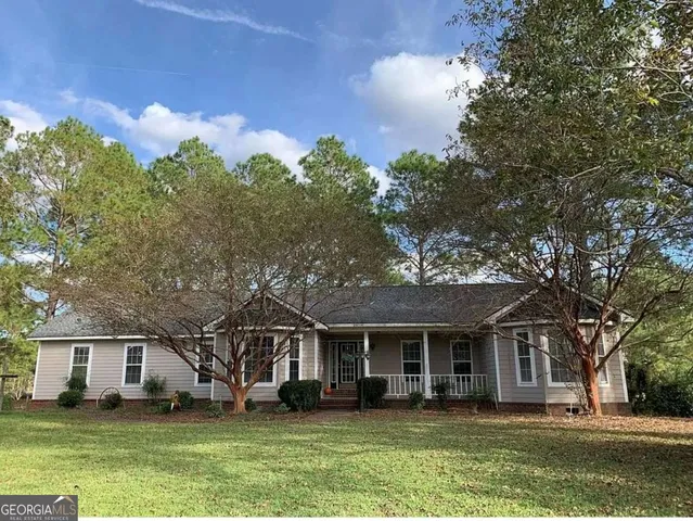 front view of a house with a garden