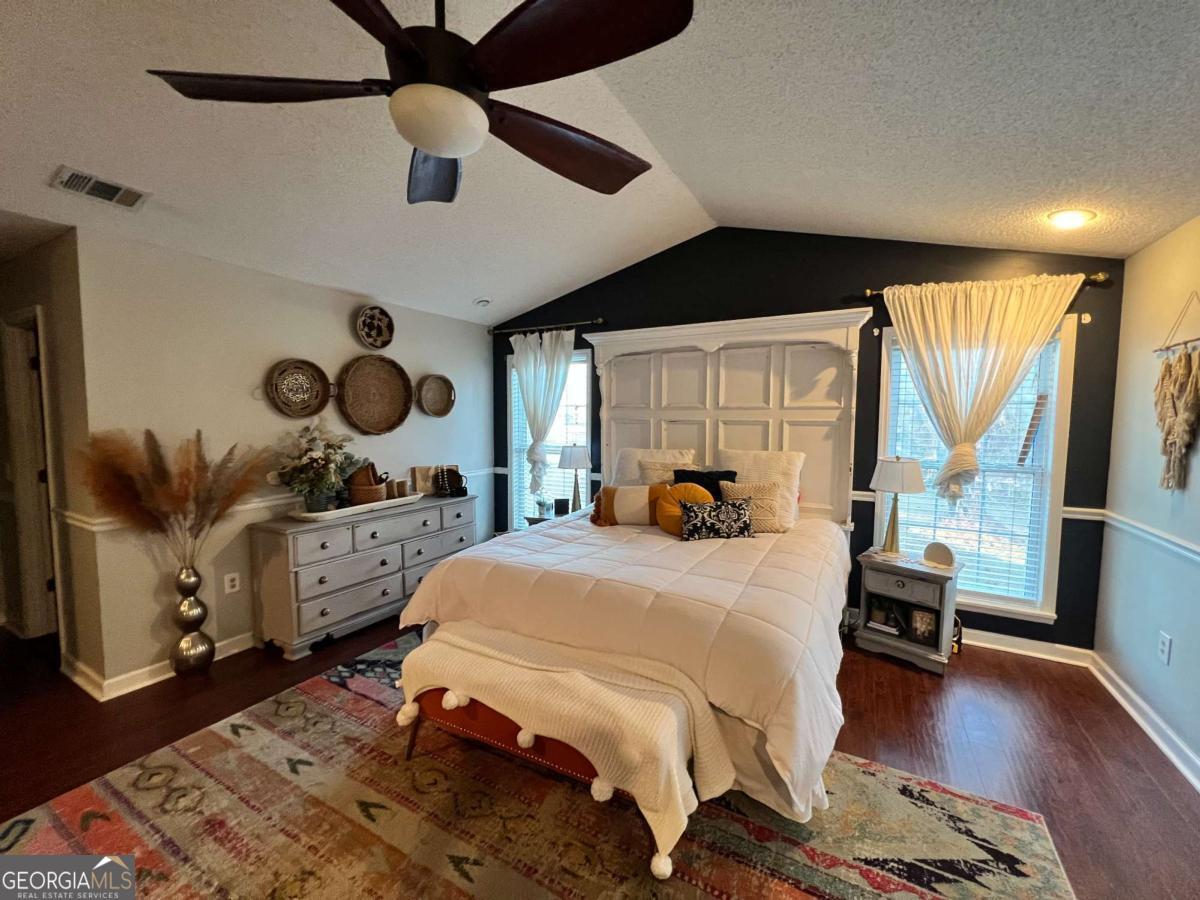 2003 Chevy Place Vidalia, GA 30474 - Photo 12 of 26 a bedroom with a bed and wooden floor