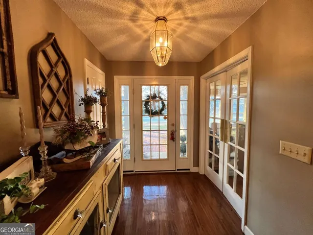 a view of walk in closet with clothes