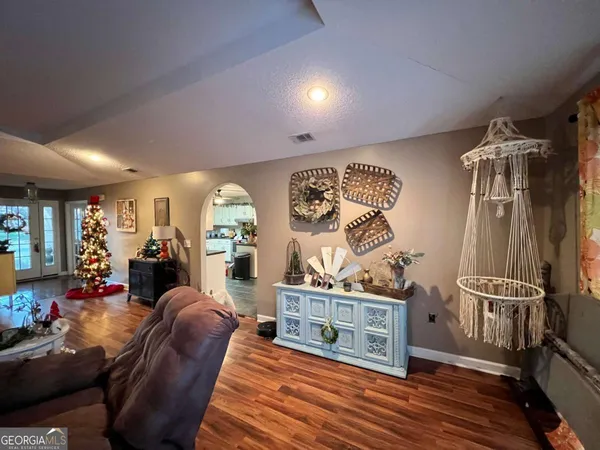 a bedroom with a bed and a tv