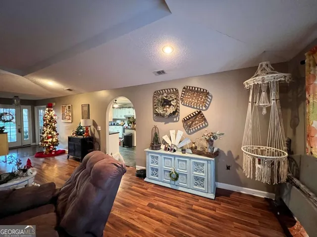 a bedroom with a bed and a tv