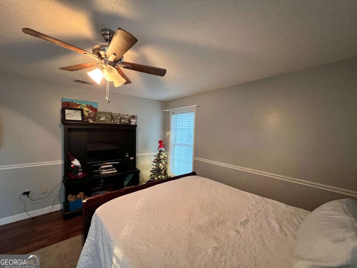 2003 Chevy Place Vidalia, GA 30474 - Photo 24 of 26 a bedroom with a bed and a tv