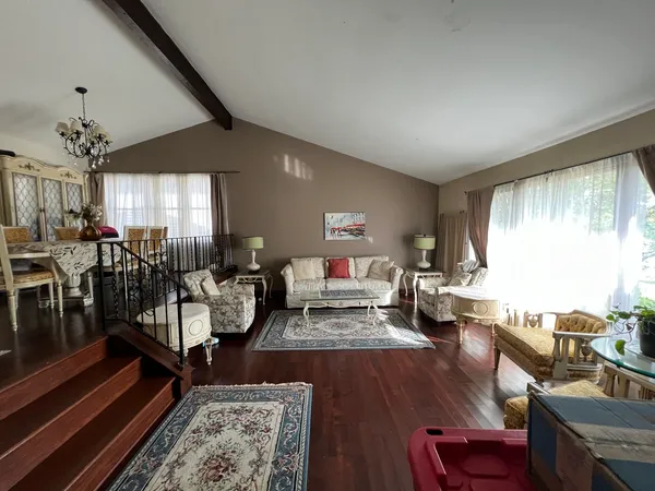 a living room with furniture and a table
