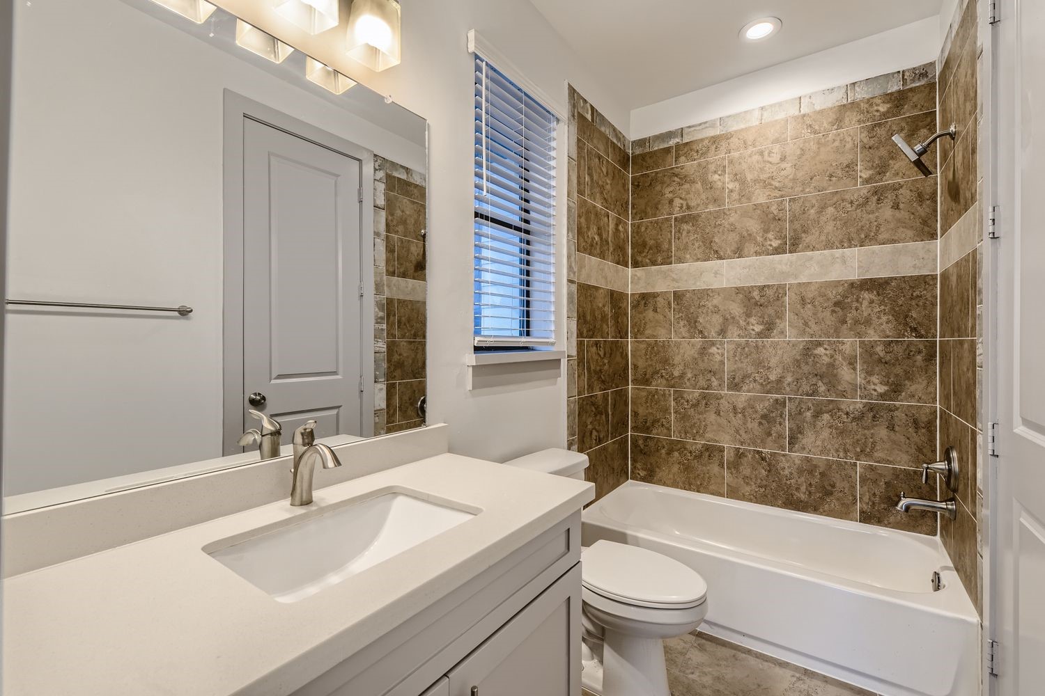 2208 Arabelle Street Houston, TX 77007 - Photo 15 of 26 a bathroom with a sink a toilet and shower