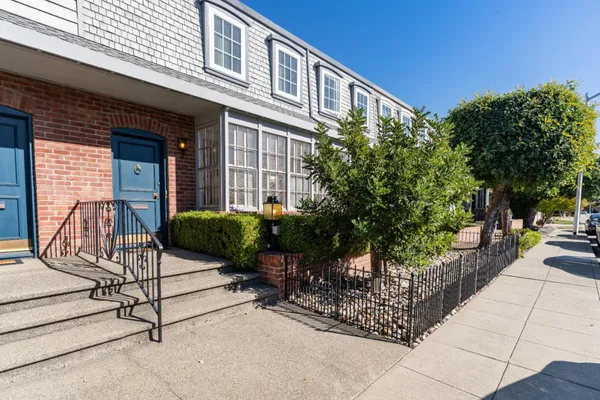 a view of a chairs and table in the patio